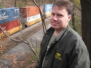 My neighbor, Will, at Camp Highland with train in the background.